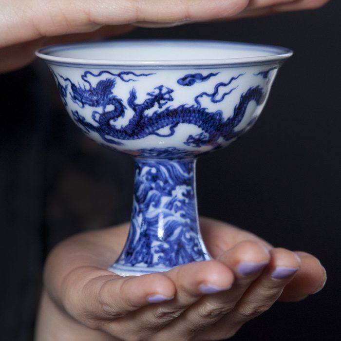 FILE PICTURE - A 600-year-old china cup valued in excess of £4 million is set to go up for sale at a special auction by Lyon & Turnbull. The Ming stem cup, dates back to around 1425, is the star lot of a specially curated sale of Chinese works of art in Hong Kong on May 31. Feb 10 2016. A rare Chinese cup that was kept in an unlocked university cupboard for 30 years after being dismissed as a "dusty old pot" is set to fetch a staggering £4 MILLION at auction. See NTI story NTICUP. The four-inch tall vessel was put into storage and forgotten about at Staffordshire University after being donated during the Second World War. But during a clear-out last year staff noticed the cup in an unlocked corridor on the campus and decided to investigate further. And boffins were left stunned when it turned out blue and white Stem Cup which is thought to have been made for an emperor during the Ming dynasty in 1425. It was part of a collection of more than 270 pieces which was donated to Staffordshire University during World War Two by London pharmacist Ernest Thornhill.